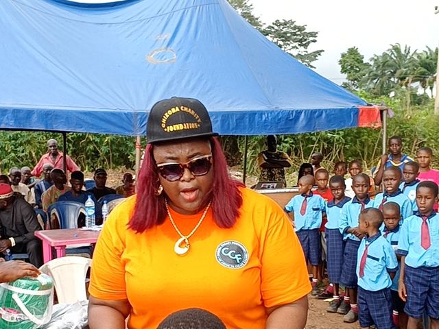 A volunteer works through the queue of waiting pupils.