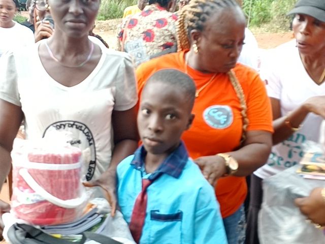 A pupil with his new school supplies.