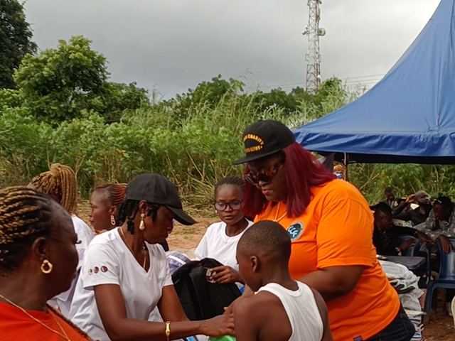 A pupil receives her bag.