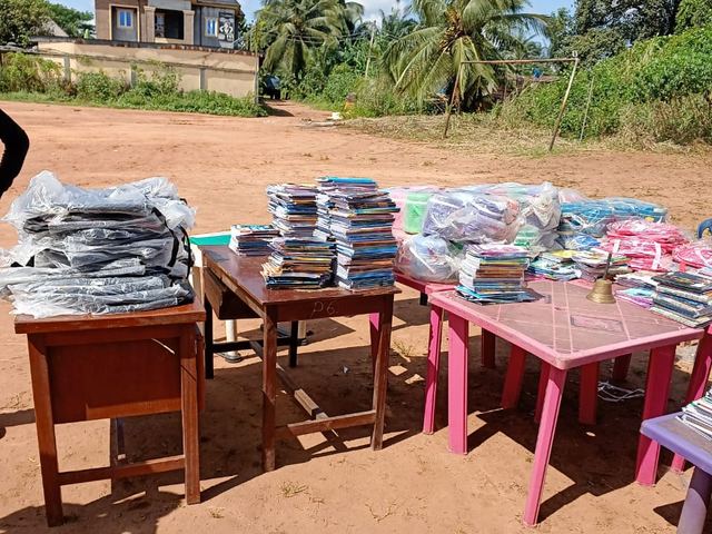 Bags, books and stationery sorted for distribution.