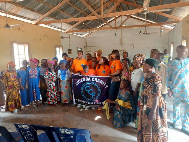 The Foundation banner raised among the people it was there to serve.