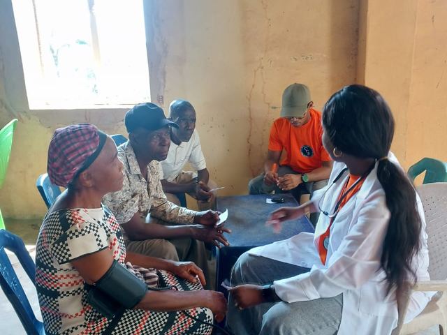 A doctor examines a patient during the screening.