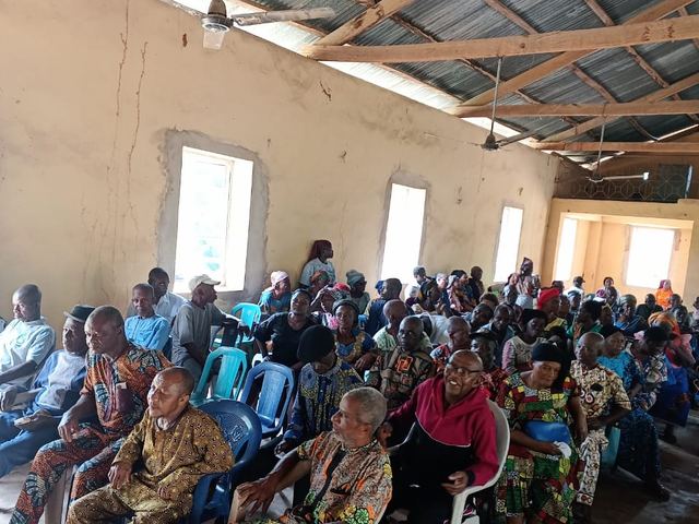 Community members seated through the day's programme.