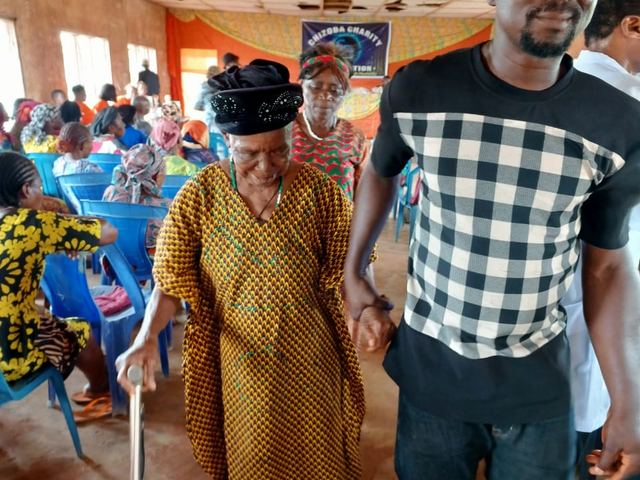 Walking an elderly beneficiary to the consulting area